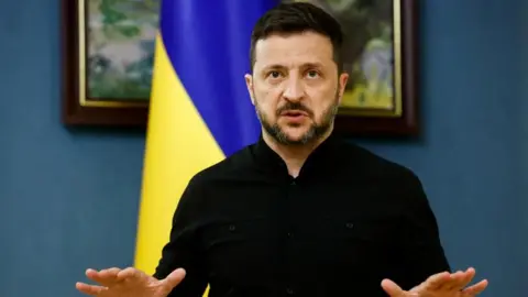 Zelensky gestures as he speaks