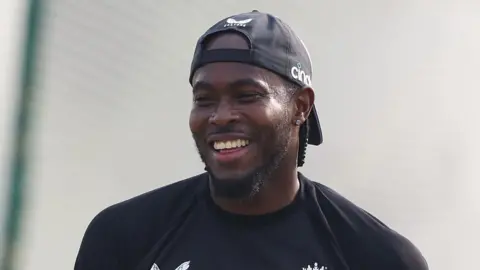 England fast bowler Jofra Archer smiles in training