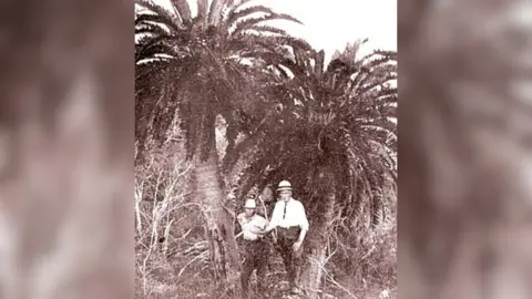 University of Southampton An old picture of two men stood in front of a large tree