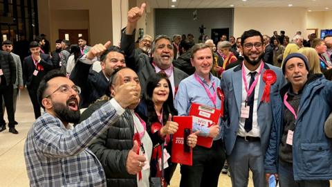 Labour Party members celebrating winning seats from Peterborough's Tories on 2 May