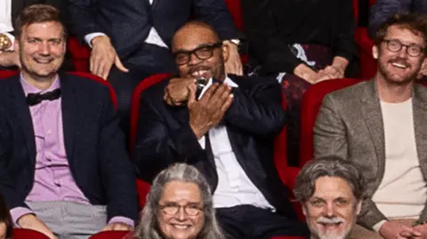 AMPAS Clarence Maclin in the 97th Oscars nominees dinner class photo