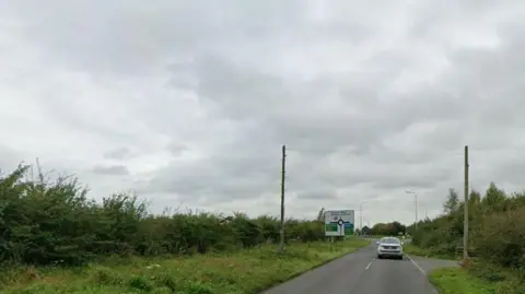 Google A general view of Burgh Road, off which the development would be built. It is a single carriage rural road flanked by hedges.
