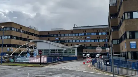 PA Media The front of the Queen's Medical Centre.