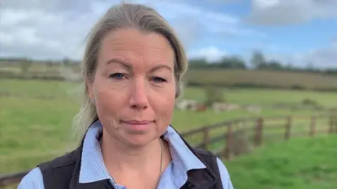 Head and shoulders shot of farmer Jo Belcher on her farm