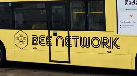 Bee Network on yellow coloured bus in Greater Manchester