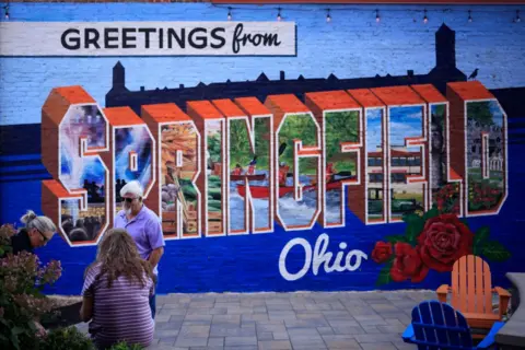 Getty Images A mural reads "Greetings from Springfield, Ohio"