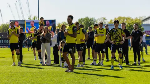 Getty Images Oxford United players applaud the fans after the Sky Bet Championship match between Oxford United and Sheffield Wednesday at Kassam Stadium on April 25, 2026 in Oxford, England. 