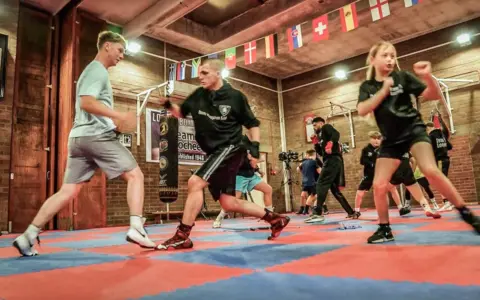 Boys and girls boxing in Lochee Boys and Girls Club