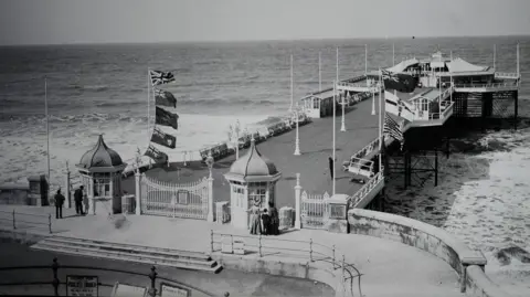 Cromer Museum A view of Cromer Pier in a black and white image from the early 1900s