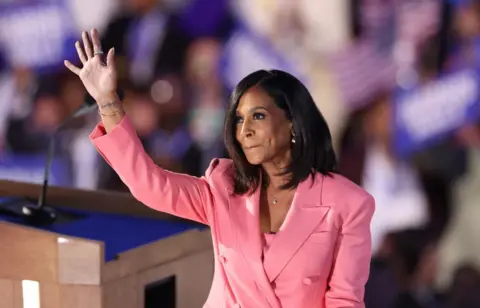 Getty Images Maya Harris waves after speaking at the Democratic National Convention in Chicago.