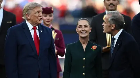 Reuters US President Donald Trump, Mexican President Claudia Sheinbaum and Canada's Prime Minister Mark Carney during the trophy presentation at the World Cup