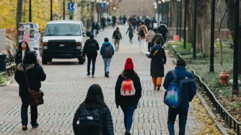 Students walk on path