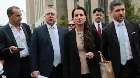 Getty Images Mangione's defence team leave court. Pictured from left to right: Marc Agnifilo, Karen Friedman Agnifilo, and Jacob Kaplan.
