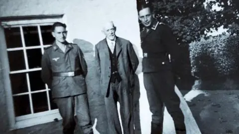 Pierre Tostevin Photo of Pierre's father at Plaisance with German soldiers during the occupation