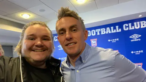 Rhys Gooding Ipswich Town fan Rhys Gooding with manager Kieran McKenna