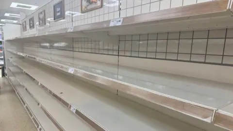 A shot of empty shelves at a supermarket.