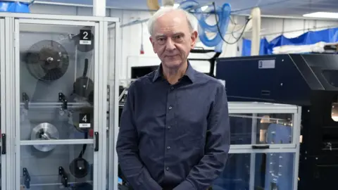 A man stood looking at the camera 