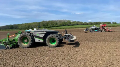 Kate Bradbrook/BBC Two driverless tractors on farmland