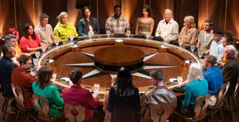This year's contestants sitting at the round table on The Traitors