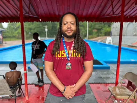 Brandon Drenon/BBC Tuskegee Mayor Chris Lee, whom locals often refer to as "coach mayor", was awarded a medal by residents 