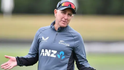 Gary Stead holds his arms out during a New Zealand cricket training session