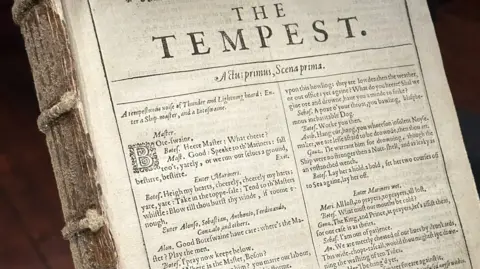 Close up of the front of the book, which is a page with the play The Tempest beginning on it
