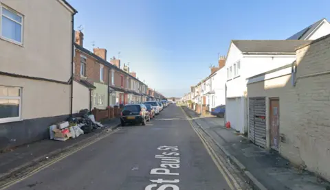 St Paul's Street in Swindon. It is a residential street, with rows of terraced houses and parking to the left hand side. There are double yellow lines on the right of the carriageway.