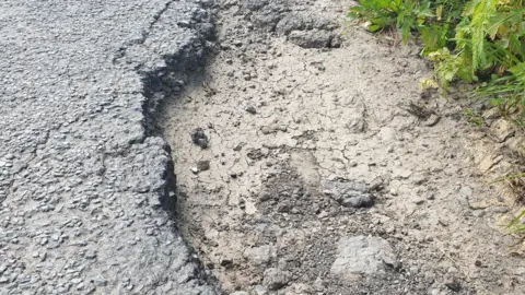 LDRS Pothole on side of road