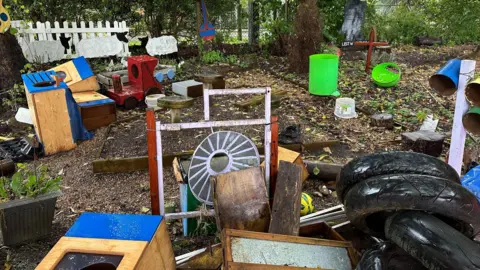 Eric Johnson/BBC Wet and muddy play equipment at a school 