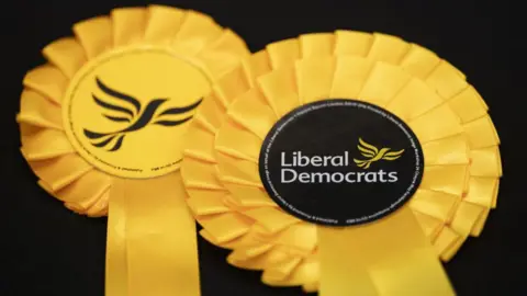 Getty Images Yellow Liberal Democrat rosettes