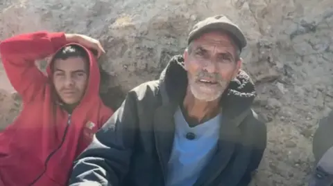 Wael Al-Najjar and his son