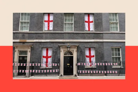 Getty Images The windows of 10 Downing St decorated with four St George's flags