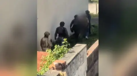 BBC A still from a video which showed counter-terrorism officers making an arrest