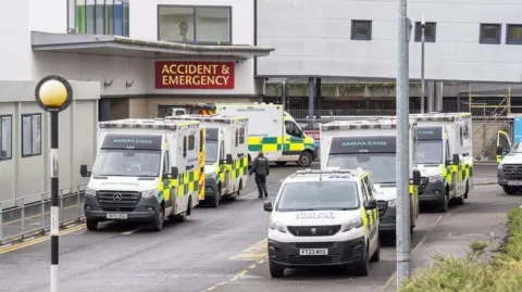 PA Media The accident and emergency department at Victoria Hospital in Kirkcaldy with ambulances parked outside