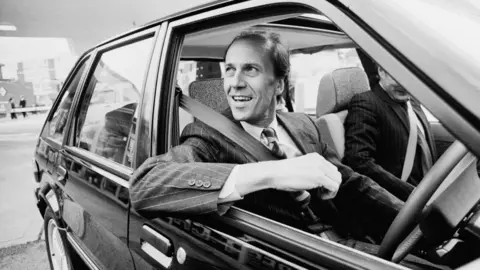 Getty Images Norman Tebbit driving a car