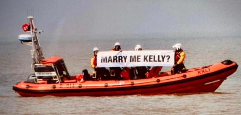 Lifeboat with proposal sign that reads: 'Marry me Kelly?'