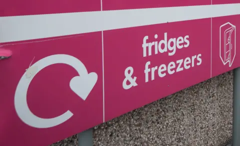 Oxfordshire County Council A close up of a sign at a tip. It's pink and says "fridges and freezers".