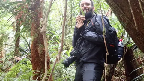 Orion Hidalgo Scientist collecting ferns from the rainforest