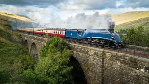 Martin Price A steam locomotive crossing a viaduct