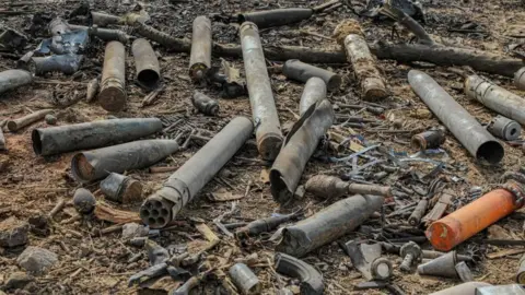 Reuters Shells at the site of the explosion at the arsenal in N'Djamena, Chad - 19 June 2024