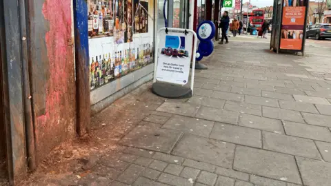 LDRS dried paan splats on a wall in a street in Brent