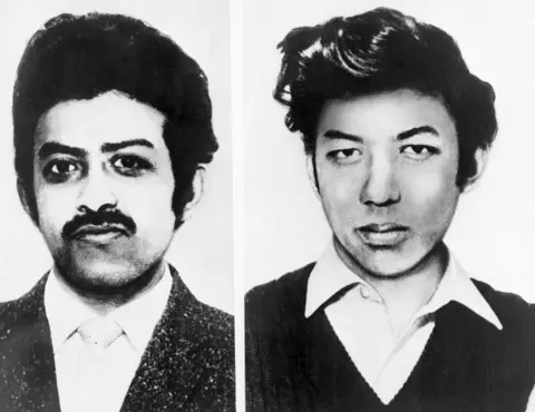 Getty Images Black and white mugshot of Arthur and Nizam