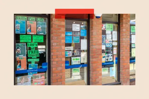 Getty Images Posters and signs for training courses and job opportunities in the window of a Jobcentre Plus
