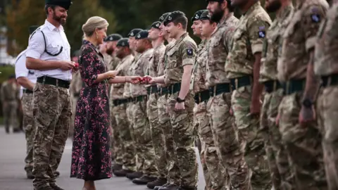 British Army HRH, the Duchess of Edinburgh welcoming home a line of uniformed soldiers