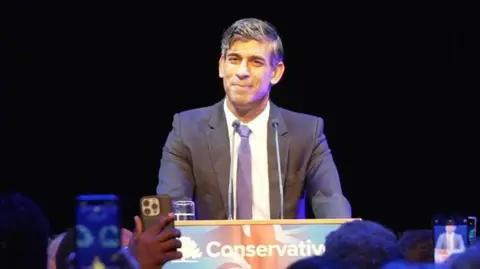 BBC Rishi Sunak smiles at cheering crowd