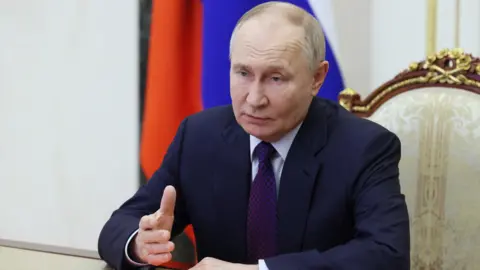 Reuters President Putin speaks at a security council meeting in February 2025