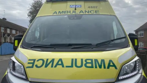 A front view of an NHS ambulance