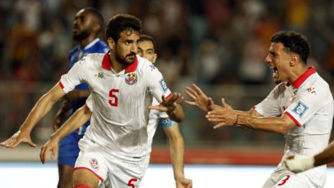 Mohamed Ali Ben Romdhane (left) celebrates a goal for Tunisia
