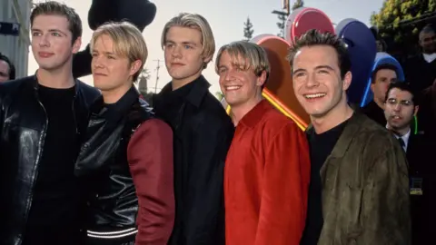 Vinnie Zuffante/Getty Images Boy band Westlife attend the 25th Anniversary Arista Records Show taping held at the Shrine Auditorium in Los Angeles, California, United States, 10th April 2000. 