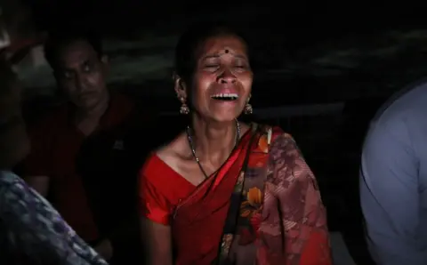 EPA Family members of stampede victims mourn outside a hospital in Hathras, Uttar Pradesh, India, 02 July 2024